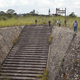 Men walk around the area where uranium was once mined, at the Shinkolobwe Cobalt mine